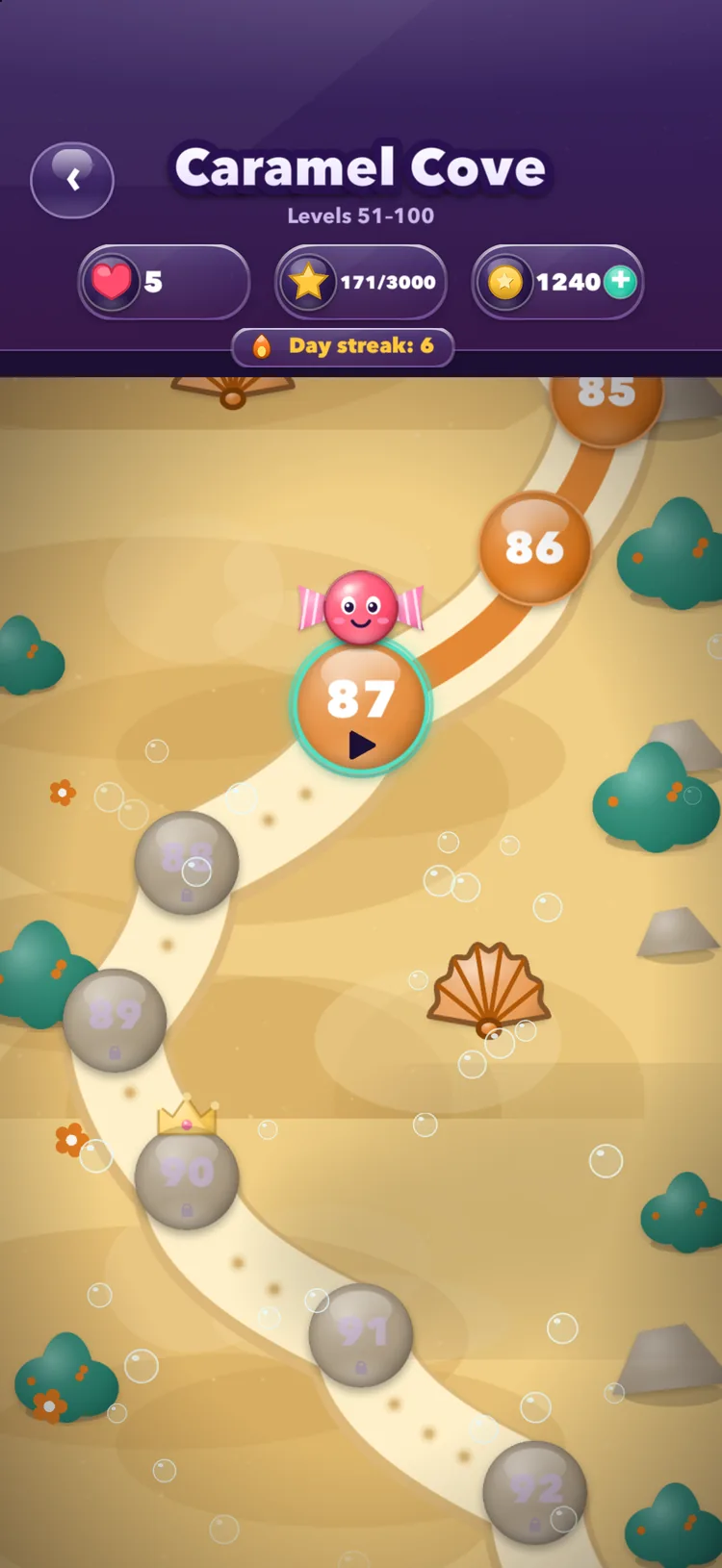 Inside a chapter — the trail through Caramel Cove, level 87 ready to play and the levels beyond it still locked
