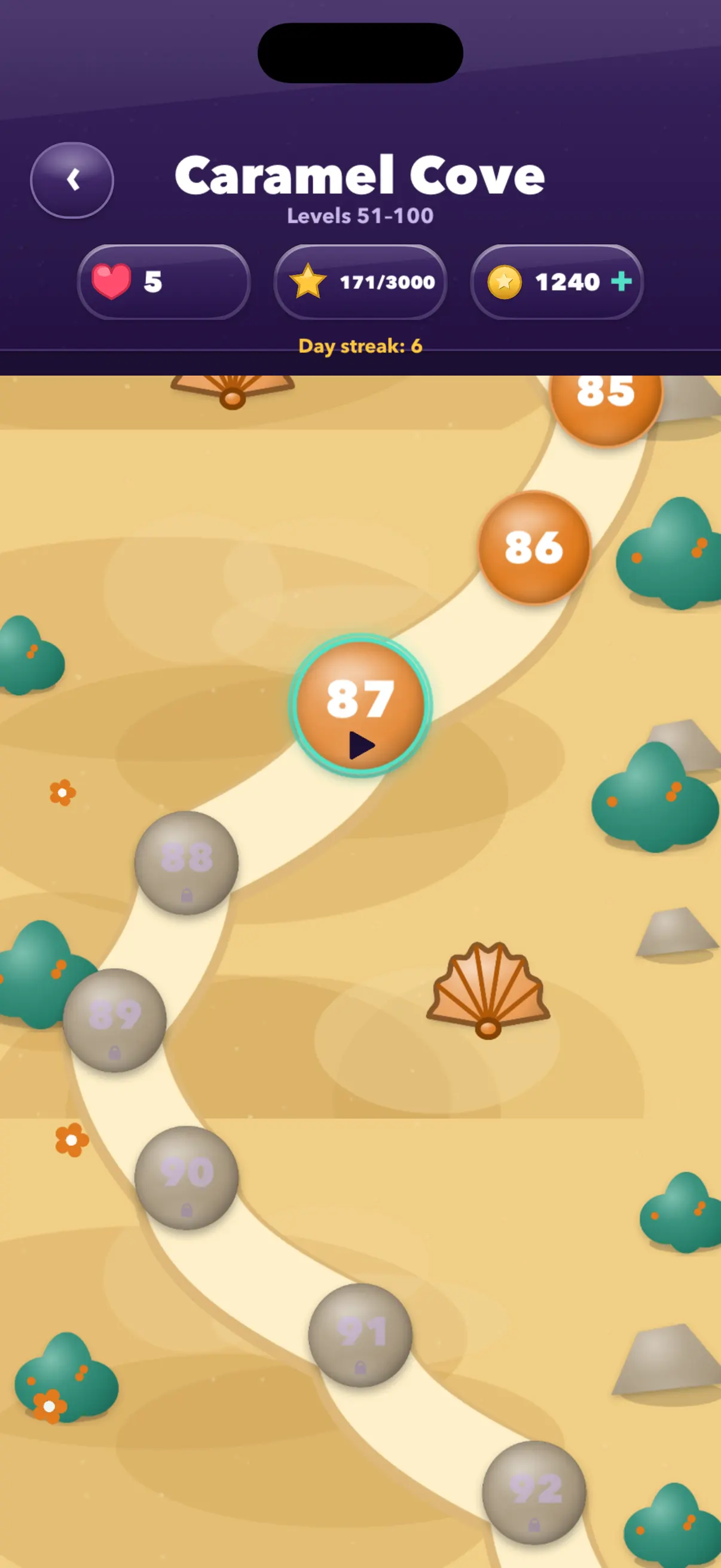 Inside a chapter — a winding trail through Caramel Cove, the next level ready to play and the ones beyond it still locked